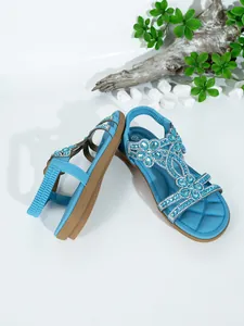 Blue bohemian flat sandals featuring intricate rhinestone floral patterns and soft soles