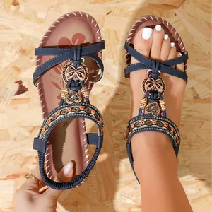Bohemian navy blue flat sandals with decorative floral beads and heart charms for beach wear