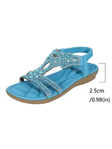 Light blue bohemian flat sandals with rhinestone flower detail and 2.5cm heel height