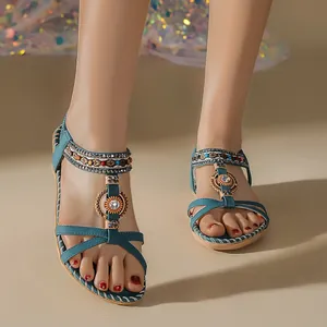 Bohemian flat sandals with colorful hand-beaded rhinestones for summer beach wear.