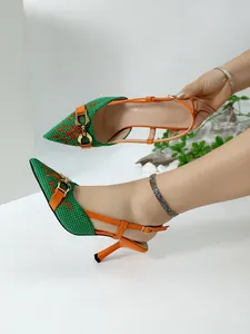 Green woven pointed toe slingback heels with orange straps and gold buckle detail