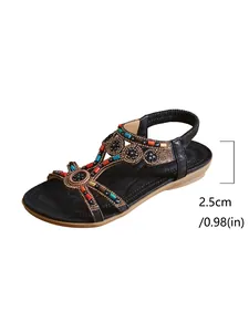 Close-up detail of ethnic style rhinestone flat sandal showing a comfortable 2.5cm heel height