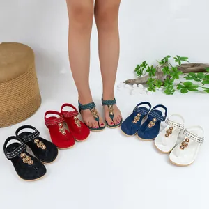 Bohemian style flat sandals with rhinestone flower detail in five vivid colors
