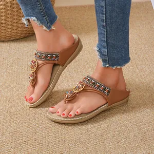 Bohemian ethnic flip-flop sandals for women with beaded straps and comfortable flat soles.