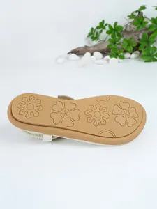 Detail view of the floral patterned anti-slip sole on Bohemian style flat sandals.