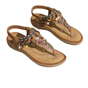Ethnic bohemian φλατ σανδάλια με πολύχρωμες χάντρες και ελαστικό λουράκι για γυναίκες.
