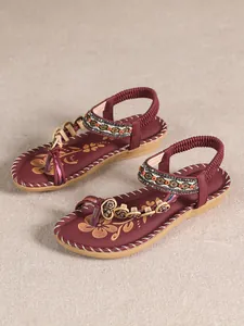 Bohemian burgundy flat sandals featuring intricate beadwork and rhinestone details