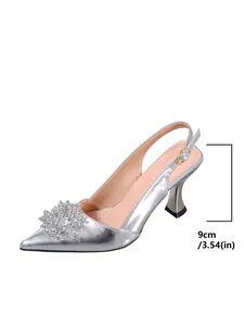 Silver pointed toe slingback sandals with rhinestone flower detail and 9cm thin heel
