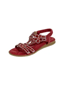 Detailed view of bohemian red flat sandals with sparkling rhinestone floral patterns