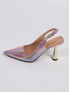 Close-up detail of women iridescent pink snakeskin slingback heels with gold stiletto