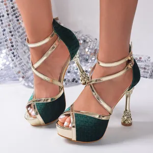 Elegant green velvet and gold cross-strap sandals with luxury wine glass stiletto heels