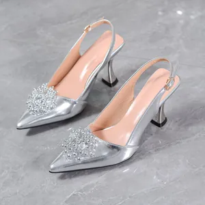 Elegant silver pointed-toe slingback high heels featuring luxury beaded clusters and kitten heels