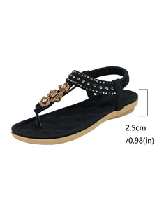 Detail view of Bohemian flat sandal with 2.5cm heel height and rhinestone accents