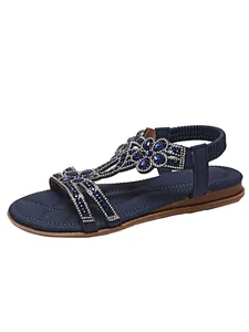 Detail view of navy blue bohemian flat sandals with sparkling beads and rhinestones