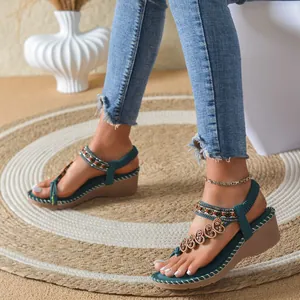 Stylish Bohemian teal wedge sandals featuring colorful beads and heart-shaped charms