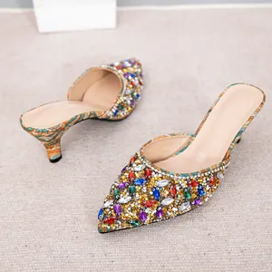 Elegant pointed-toe kitten heel mules with vibrant multi-colored rhinestones for weddings.