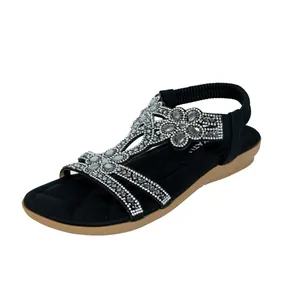 Elegant black women's flat sandals with rhinestone floral patterns for summer beach wear
