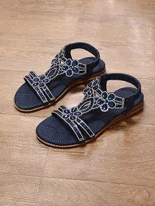 Bohemian navy blue flat sandals with sparkling rhinestone flower embellishments