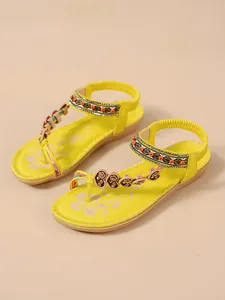 Bohemian yellow flat sandals with beaded and rhinestone flower details for beach.