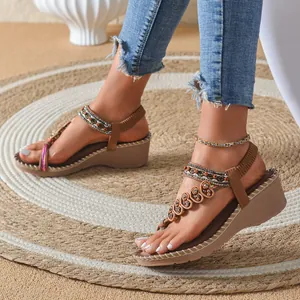 Stylish Bohemian platform sandals with heart charms and beaded straps for beach outings.