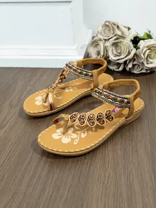 Bohemian flat thong sandals with beaded straps and floral printed insole detail