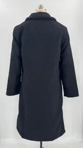 Detailed back view of a cozy black fuzzy teddy fleece long coat with lapel collar