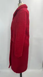 Side view of a red textured plush long coat for women with a lapel collar design.