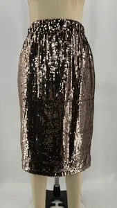 Macro detail of a rose gold shimmering sequin bodycon skirt shown on a dress form