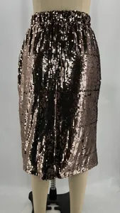 Macro view of densely packed bronze sequins on a high-waisted bodycon pencil skirt