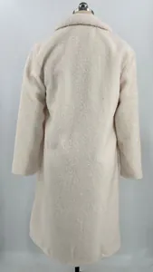 Detailed back view of a warm cream-colored teddy fleece long coat for women's winter