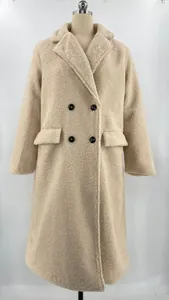 Close-up detail of women's long sleeve lapel cream teddy fleece winter coat