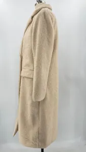 Detail side view of women's plush long coat with lapel collar on mannequin, beige color.
