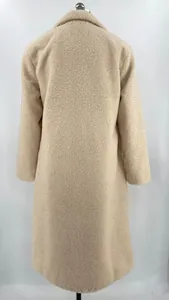 Back view of a cozy beige sherpa plush winter coat featuring a classic lapel design