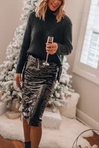 Elegant black sequined midi skirt in a festive holiday party setting