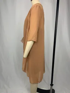 Side view of an elegant solid color chiffon two-piece dress set displayed on a mannequin