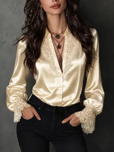 Elegant champagne satin blouse with delicate lace V-neck and puff sleeves for women.