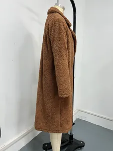 Detailed side profile of a long brown teddy coat with lapel collar on a studio mannequin.