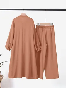 Chic women's two-piece set featuring long-sleeved lapel shirt and matching wide-leg pants