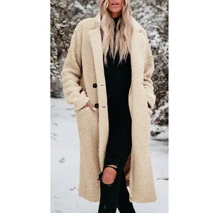 Warm beige long-sleeve plush teddy coat with lapels for women in a winter snow scene