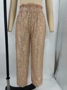 High-waisted rose gold sequined pants with ruffled elastic waistband shown on mannequin