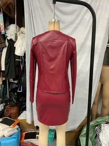 Detailed back view of a burgundy faux leather long sleeve jacket and dress two-piece set
