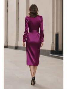 Elegant purple satin long sleeve midi dress with waisted silhouette seen from the back