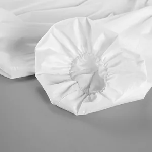 Detailed close-up showing the elasticated cuff texture on a white pure cotton designer top.