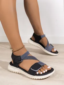 Side view detail of women's comfortable platform sandals with woven blue straps