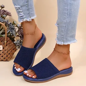 Close-up detail of navy blue mesh knit platform slides with comfortable thick sole