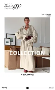Detail of a chic French style long sleeve V-neck linen maxi dress with tie waist