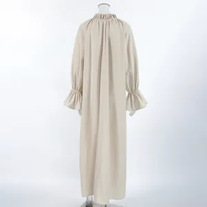 Detailed back view of a French style linen maxi dress with ruffled collar and bell sleeves