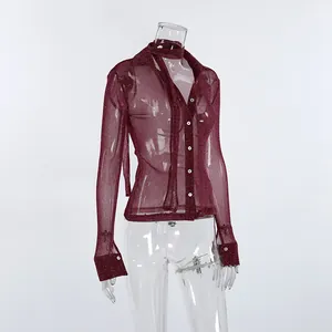 Macro view of the sheer burgundy glitter long sleeve shirt with elegant neck sash