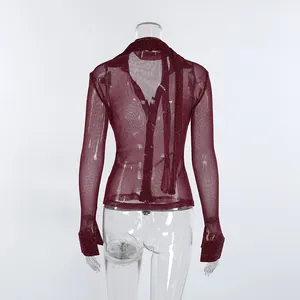 Detailed back view of sheer maroon shimmer shirt featuring an elegant tie neck detail.