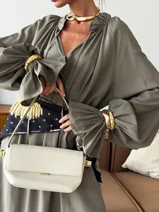 Elegant French style V-neck linen maxi dress featuring chic puff sleeves and a tie waist